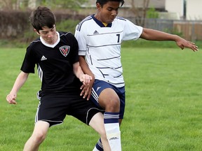 Northern Vikings' Jack Adair, left, and Chatham-Kent Golden Hawks' Asraf Zaman battle for the ball in the second half of an LKSSAA senior boys' soccer game at the Chatham-Kent Community Athletic Complex on Thursday, April 27, 2017. The Vikings won 5-0. In the senior girls' game, Abby Allardyce scored for the Vikings in a 1-0 win over the Golden Hawks. (MARK MALONE/Postmedia Network)