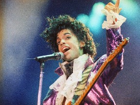 In this Feb. 18, 1985 file photo, Prince performs at the Forum in Inglewood, Calif. A pair of record labels announced Friday, April 28, 2017, that a remastered edition of Prince’s landmark 1984 album “Purple Rain” will be released on June 23, 2017. The labels say Prince oversaw the remastering process in 2015 and the “Purple Rain Deluxe” will include six previously unreleased songs by the late singer-songwriter, who died one year ago.
(AP Photo/Liu Heung Shing, File)