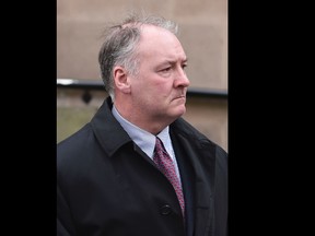 In this Tuesday Feb. 21, 2017 file photo, former breast surgeon Ian Paterson arrives at Nottingham Crown Court in Nottingham, England. A jury in central England has found a prominent breast surgeon guilty of carrying out unnecessary operations. The Nottingham Crown Court jury found Ian Paterson guilty on Friday, April 28 of 17 counts of wounding with intent to cause grievous bodily harm and three counts of unlawful wounding. Prosecutors say the 59-year-old doctor lied to patients or exaggerated their risk of cancer to persuade them to have surgery. (Joe Giddens/PA via AP, file)