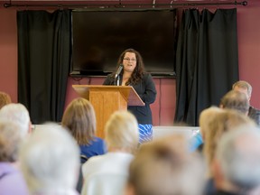 Stony Plain MLA Erin Babcock, pictured above at a 2015 town hall meeting with constituents, pushed the Alberta government on their plans to address ongoing struggles faced by farmers after a disasterous harvest season.