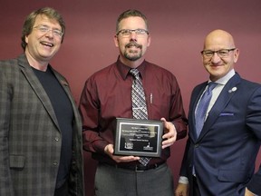 Photo supplied by Town of Stony Plain
T.J Beyer of Parkland Funeral Serivces receives milestone recognition on behalf of the business for 35 years of continued service in Stony Plain.