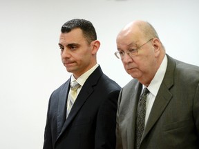 Richard Dabate, left, stands with his lawyer Hubert Santos at Superior Court in Rockville, Conn., Friday, April 28, 2017. Debate is charged with killing his wife, Connie, in their Ellington home in 2015. Connecticut State Police said Fitbit information helped lead to the arrest of Dabate. Troopers said the data helped establish a timeline and showed that Connie Dabate’s final movements were an hour after the time Richard Dabate told police than an intruder killed her. (Stephen Dunn/Hartford Courant via AP, Pool)