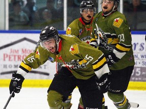 Powassan Voodoos forward Ryan Theriault (15) celebrates a goal with his teammates during the NOJHL playoffs. Theriault, who hails from Hanmer, will compete at the Dudley Hewitt Cup central Canadian junior A championship, to be played in Trenton, Ont. May 2-6. Dave Dale/Postmedis Network