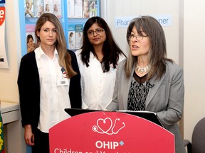 Kingston and the Islands MPP Sophie Kiwala speaks about Ontario's latest budget at the Shoppers Drug Mart at 1101 Princess St. in Kingston. Kiwala is speaking  in front of Shoppers' pharmacy assistant Sarah Lecourt and pharmacist Jalta Shah. (Ian MacAlpine/The Whig-Standard)