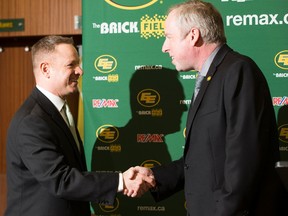 The Edmonton Eskimos President and CEO Len Rhodes, right, introduces new general manager Brock Sunderland at Commonwealth Stadium in the Eskimos locker room on Tuesday April 25, 2017, in Edmonton.