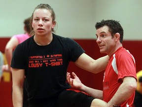Ted Rhodes/Postmedia Network file photo
University of Calgary Dinos wrestler Justine Bouchard works with coach Paul Ragusa of Kingston during a practice in 2013. Ragusa is in the Kingston and District Sports Hall of Fame’s 2017 inductee class.