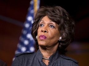 In this Feb. 28, 2013 file photo, Rep. Maxine Waters, D-Calif., listens during a news conference on Capitol in Washington. Waters has served in Congress for a quarter-century. Now she’s turned into the passionate voice of resistance against the Trump administration. (AP Photo/J. Scott Applewhite, File)