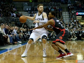 Matthew Dellavedova of the Milwaukee Bucks dribbles the ball while being guarded by Kyle Lowry of the Toronto Raptors in the second quarter of Game 6 at BMO Harris Bradley Center on April 27, 2017. (Dylan Buell/Getty Images)