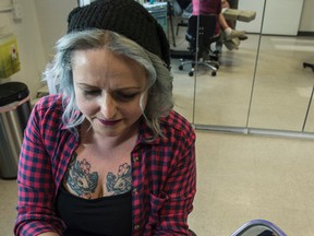 Tattoo artist Jessie Jones inks customer and Edmonton Oilers super-fan Darcy Niedzielski with an Oilers Nation logo at Shambhala Tattoos in Old Strathcona on April 26, 2017.