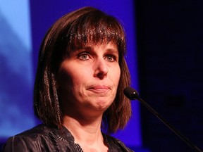 Janice Martell, project founder of the McIntyre Powder Project, becomes emotional as she addresses an audience at the Sudbury and District Labour Council's Day of Mourning ceremony at Laurentian University in Sudbury, Ont. on Friday April 28, 2017. John Lappa/Sudbury Star/Postmedia Network