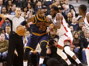 Raptors' DeMarre Carroll (right) tries to cover LeBron James (23) of the Cavaliers during NBA action in Toronto on Dec. 5, 2016. The Raps take on the Cavs in the second round of the NBA playoffs. (Michael Peake/Toronto Sun/Files)