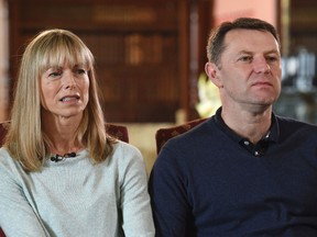 Kate and Gerry McCann, whose daughter Madeleine disappeared from a holiday flat in Portugal ten-years ago, react during a BBC TV interview in Loughborough, England, Friday April 28, 2017. The parents of Madeleine McCann have vowed to do "whatever it takes for as long as it takes" to find her as they prepare to mark the tenth anniversary of her disappearance on the evening of 3 May 2007, from her bed in a holiday apartment in Praia da Luz resort in the Algarve, Portugal. (Joe Giddens/Pool via AP)