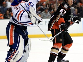 Cam Talbot #33 of the Edmonton Oilers catches a shot on goal as Rickard Rakell #67 of the Anaheim Ducks looks on during the third period of Game Two of the Western Conference Second Round during the 2017  NHL Stanley Cup Playoffs at Honda Center on April 28, 2017 in Anaheim, California.