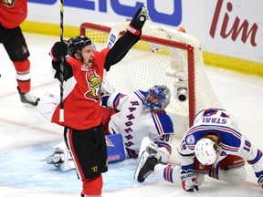 Senators right wing Mark Stone celebrates his goal on Rangers goalie Henrik Lundqvist as Rangers defenceman Marc Staal (18) reacts during the third period in Game 2 of their NHL playoff series in Ottawa on Saturday, April 29, 2017. (Adrian Wyld/The Canadian Press)