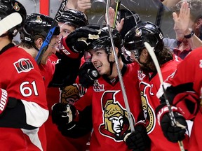 Jean-Gabriel Pageau (centre) is congratulated on his game-winning goal by his teammates in the second overtime period as the Senators defeat the Rangers in Game 2 of their NHL playoff series in Ottawa on Saturday, April 29, 2017. (Wayne Cuddington/Postmedia)
