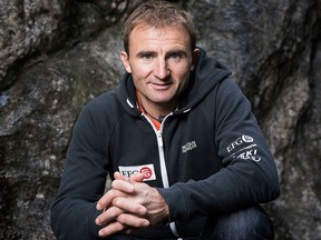 In this Sept. 11, 2015 file photo Swiss climber Ueli Steck poses for a photo at the foot of a climbing wall in Wilderswil, Canton of Berne, Switzerland. (Christian Beutler/Keystone via AP)