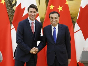 Prime Minister Justin Trudeau (L) shakes hands with Chinese Premier Li Keqiang (R) during a press conference at the Great Hall of the People in Beijing on August 31, 2016 in Beijing. (Photo by Lintao Zhang/Getty Images)