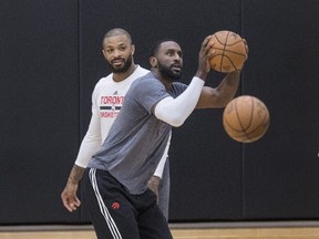 Patrick Patterson (right) and P.J. Tucker are two of the Raptors best defenders and will have their hands full guarding the Cavaliers’ LeBron James in their second-round NBA playoff series. (Craig Robertson/Toronto Sun)