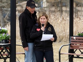 Dan Truax comforts wife Melanie Moore, co-owner of Heritage Roofing, as she describes the day in 2014 when former employee Tyler Robar, 21, died as a result of injuries on the job, during the National Day of mourning at Grande Prairie And Area Safe Communities on Friday April 28, 2017 in Grande Prairie, Alta. The memorial ceremony drew more than 60 people. Kevin Hampson/Grande Prairie Daily Herald-Tribune/Postmedia Network