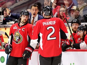 Senators head coach Guy Boucher makes a point to Dion Phaneuf while Erik Karlsson listens in the first overtime period against the Rangers in Game 2 of the NHL's Eastern Conference semifinal playoffs series on Saturday, April 29, 2017. (Wayne Cuddington/Postmedia Network)