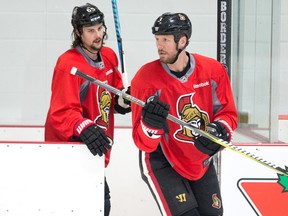 Senators defencemen Marc Methot (right) and Erik Karlsson take to the ice for practice at the Bell Sensplex in Ottawa on April 15, 2017. (Wayne Cuddington/Postmedia Network)