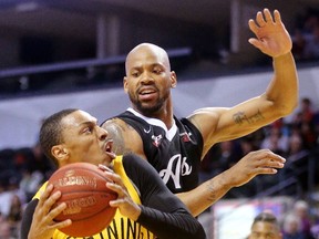 Junior Cadougan of the Lightning draws a foul on Da'Quan Cook of the Orangeville A's during their game at Budweiser Gardens on Sunday April 30, 2017. (MIKE HENSEN, The London Free Press)