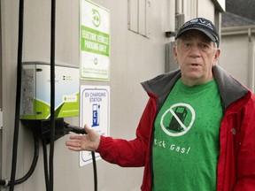 Bob Porter, founder of the London Electric Vehicle Association, shows off a public charging site he helped get set up in London?s Wortley Village. (Mike Hensen/The London Free Press)