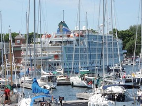 Here is the lovely cruise ship Pearl Mist, happily nestled in at the Port of Little Current, taken last summer. During the day of visit, half of her passengers enjoyed a lakeshore excursion in the morning. The others went sightseeing on the island in the afternoon, so the town of Little Current is festive. NEMI Mayor Al MacNevins loves to greet and welcome eager visitors from around the world.