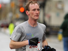 Rob Asselstine of Sydenham places first in the KRRA Limestone Race Weekend half marathon in Kingston, Ont. with a time of 1:11:59 on Sunday April 30, 2017. Steph Crosier/Kingston Whig-Standard/Postmedia Network