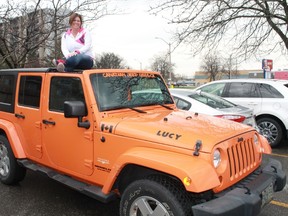 Sarnia's Natasha Kokkinis (sitting atop her jeep 'Lucy') is compiling stories, photos, videos and anecdotes of Jeepers around the world for her multimedia project, The Faces of Jeep. 
CARL HNATYSHYN/SARNIA THIS WEEK