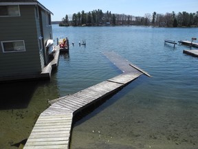 A dock is shown under water on Bayview Road in Brockville in April. (FILE PHOTO)