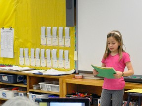 Geok-lin Milne, a staff member of Upper Thames Elementary School (UTES), records a presentation on Vincent Van Gogh by Emily Bald, a Grade 2 student, on her iPad April 20. ANDY BADER/MITCHELL ADVOCATE