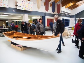 People view a hand-crafted boat at the first Woodworking Show at JR Robson School on Saturday, April 29, 2017, in Vermilion, Alta. Taylor Hermiston/Vermilion Standard/Postmedia Network.