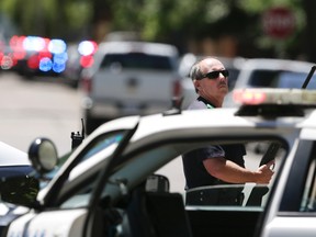 Dallas Police guard an area of a neighborhood where a shooting took place in east Dallas, Monday, May 1, 2017. Authorities said a Dallas paramedic has been shot while responding to a shooting call. (AP Photo/LM Otero)