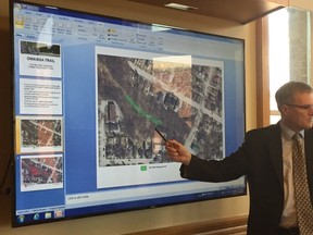 City manger Wendell Graves points out the Owaissa Trail on a map while presenting at a reference committee meeting Monday evening. City staff are mulling their options for the well-traveled footpath in the city's northwest end. (Jennifer Bieman/Times-Journal)