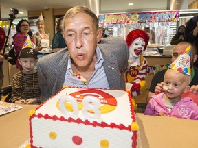 George Cohon celebrates his 80th birthday with kids staying at Ronald McDonald House in Toronto, on Monday May 1, 2017. (Craig Robertson/Toronto Sun)