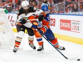 Patrick Maroon #19 of the Edmonton Oilers takes an elbow from Patrick Eaves #18 of the Anaheim Ducks in Game Three of the Western Conference Second Round during the 2017 NHL Stanley Cup Playoffs at Rogers Place on April 30, 2017 in Edmonton, Alberta, Canada.