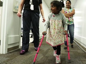 Bhoomi Manjunatha, who has cerebral palsy, survives a miracle operation, allowing her to walk with assistance. (Nationwide Children's Hospital)
