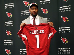Arizona Cardinals' first-round draft pick Haason Reddick holds his jersey after being introduced at the teams' training facility on April 28, 2017 in Tempe, Ariz. (AP Photo/Matt York)