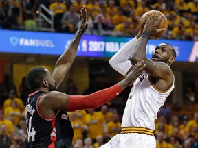 Cleveland Cavaliers' LeBron James drives to the basket against Toronto Raptors' Patrick Patterson during Game 1 in Cleveland on May 1, 2017. (AP Photo/Tony Dejak)