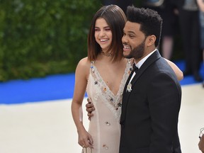 Selena Gomez (L) and The Weeknd attend the "Rei Kawakubo/Comme des Garcons: Art Of The In-Between" Costume Institute Gala at Metropolitan Museum of Art on May 1, 2017 in New York City. (Photo by Theo Wargo/Getty Images For US Weekly)