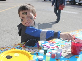 Tristan Holroyd, 5, paints a rock at the Oxford-Elgin Child & Youth Centre's barbeque and family fun event on Monday. The event was to help raise awareness about child and youth mental health during Mental Health Week, May 1-7.