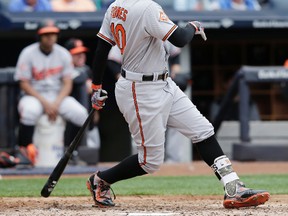 Baltimore Orioles' Adam Jones hits an RBI-single during the third inning of a baseball game against the New York Yankees at Yankee Stadium, Sunday, April 30, 2017, in New York. (AP Photo/Seth Wenig)