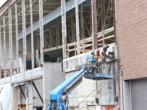 Jason Miller/The Intelligencer
The north wall of Yardmen Arena has been torn apart so a new steel frame can be erected to facilitate the expansion.