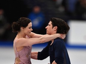 Tessa Virtue and Scott Moir of Canada perform their routine to win the Ice Dance/Free Dance event at the ISU World Figure Skating Championships in Helsinki, Finland. (AFP photo)