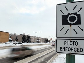 When a motorist blows by a school bus with flashing lights, the photo taken by onboard technology should be allowed in court to help convict the driver, PC MPP Michael Harris says. (POSTMEDIA/FILES)