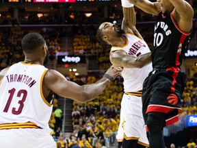 DeMar DeRozan of the Toronto Raptors passes over JR Smith and Tristan Thompson of the Cleveland Cavaliers during Game 1 at Quicken Loans Arena on May 1, 2017. (Jason Miller/Getty Images)