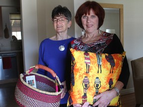 Deb Ruse, left, and Linda Champagne of the Kingston Grandmothers Connection ware seen ith items for sale at their upcoming Spring Market for Africa on Saturday. The funds raised will benefit African grandmothers. (Ian MacAlpine/The Whig-Standard)