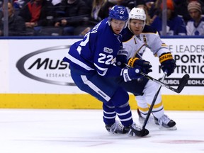 Nikita Zaitsev of the Toronto Maple Leafs battles for position against Sam Reinhart of the Buffalo Sabres at the Air Canada Centre in Toronto on Jan. 17, 2017. (Dave Abel/Toronto Sun/Postmedia Network)