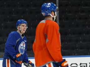 Edmonton Oilers' Connor McDavid (97) speaks with Eric Gryba (62) during practice at Rogers Place in Edmonton on Tuesday, May 2, 2017. The team plays the Anaheim Ducks in Game 4 of the Stanley Cup playoffs Western Conference semifinal.